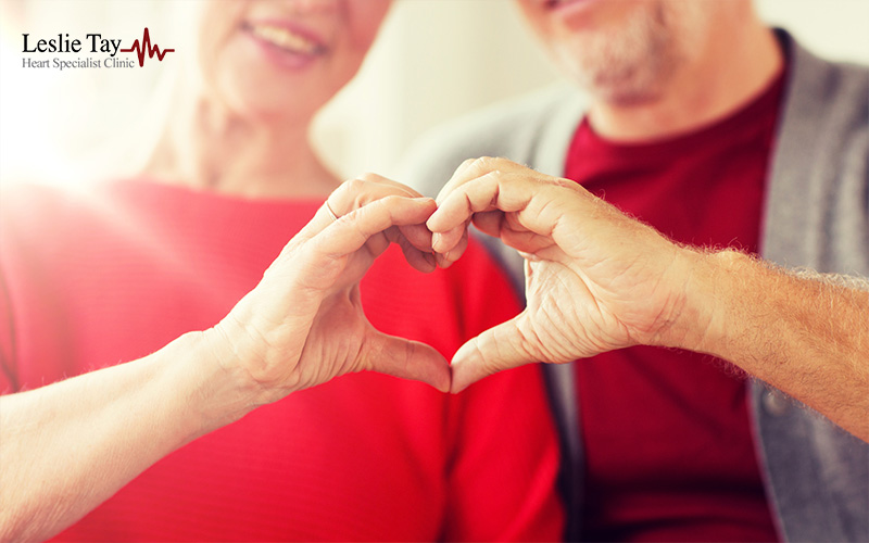 Senior Couple Showing Hand Heart Gesture